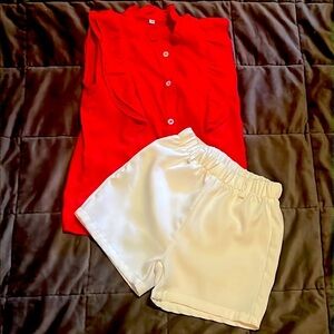Two piece set red blouse with white shorts.
